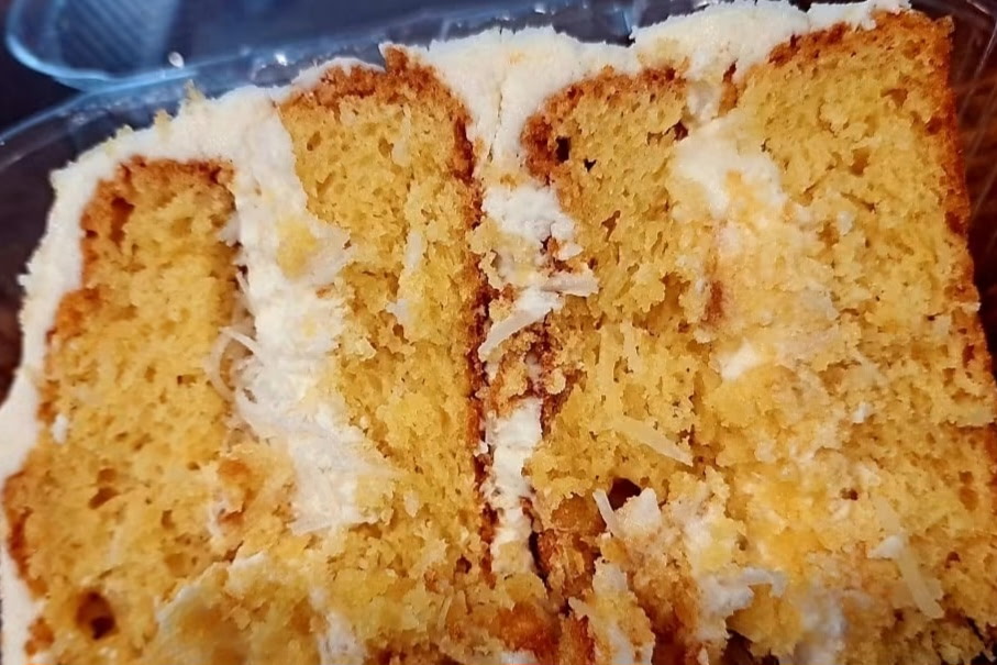 A slice of Coconut cake from Twisted Whisk