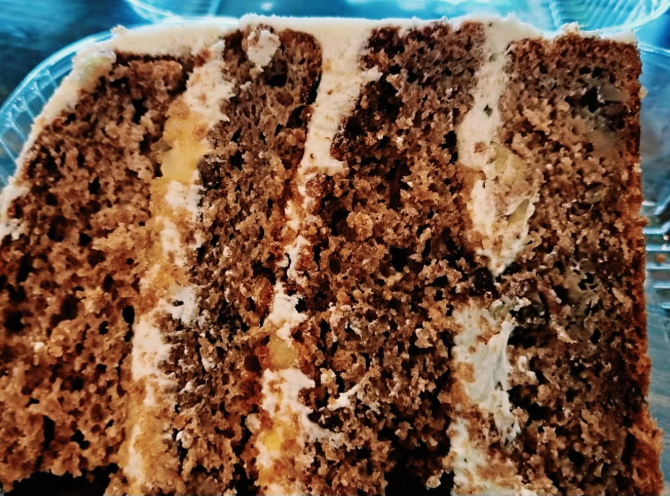 A slice of Hummingbird cake from Twisted Whisk