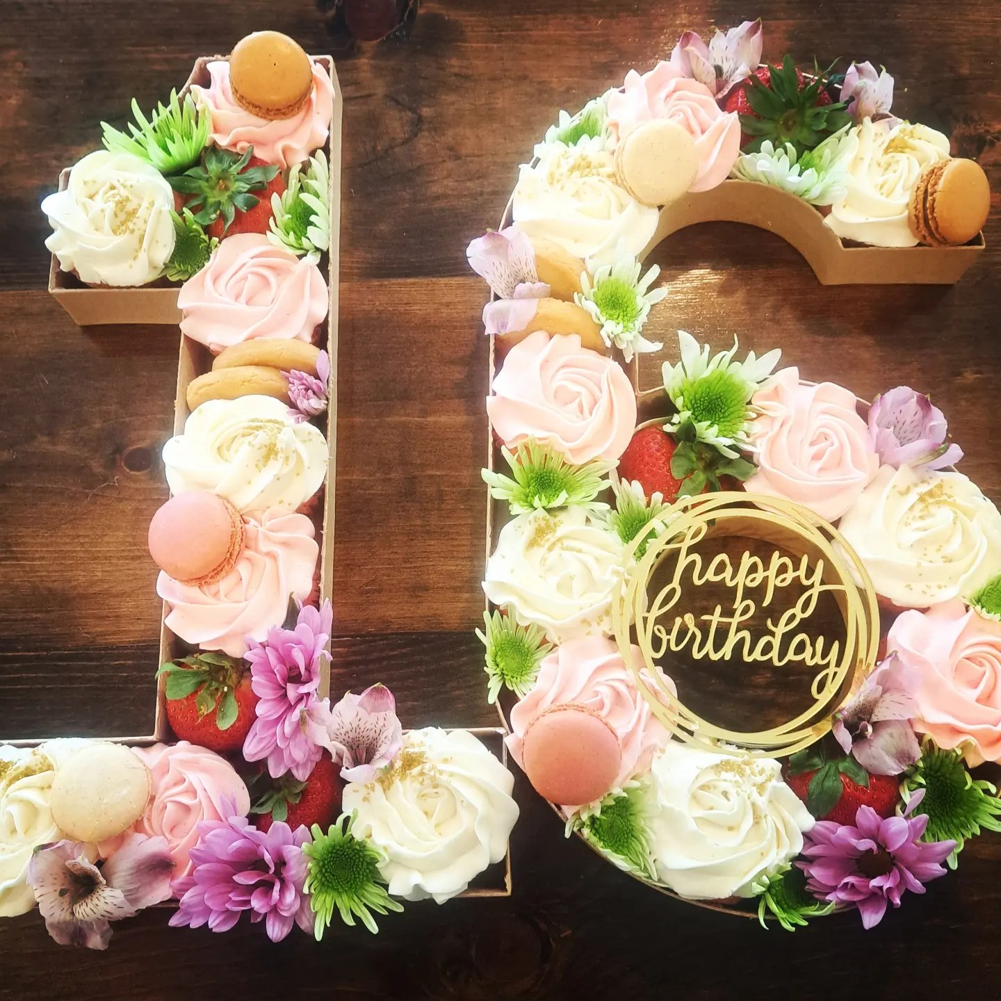 A floral birthday letter cake made by Twisted Whisk