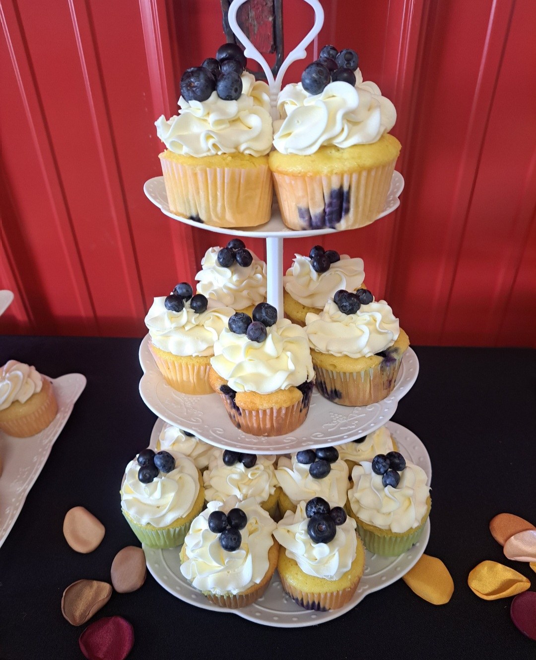 A tiered tower of blueberry cupcakes made by Twisted Whisk