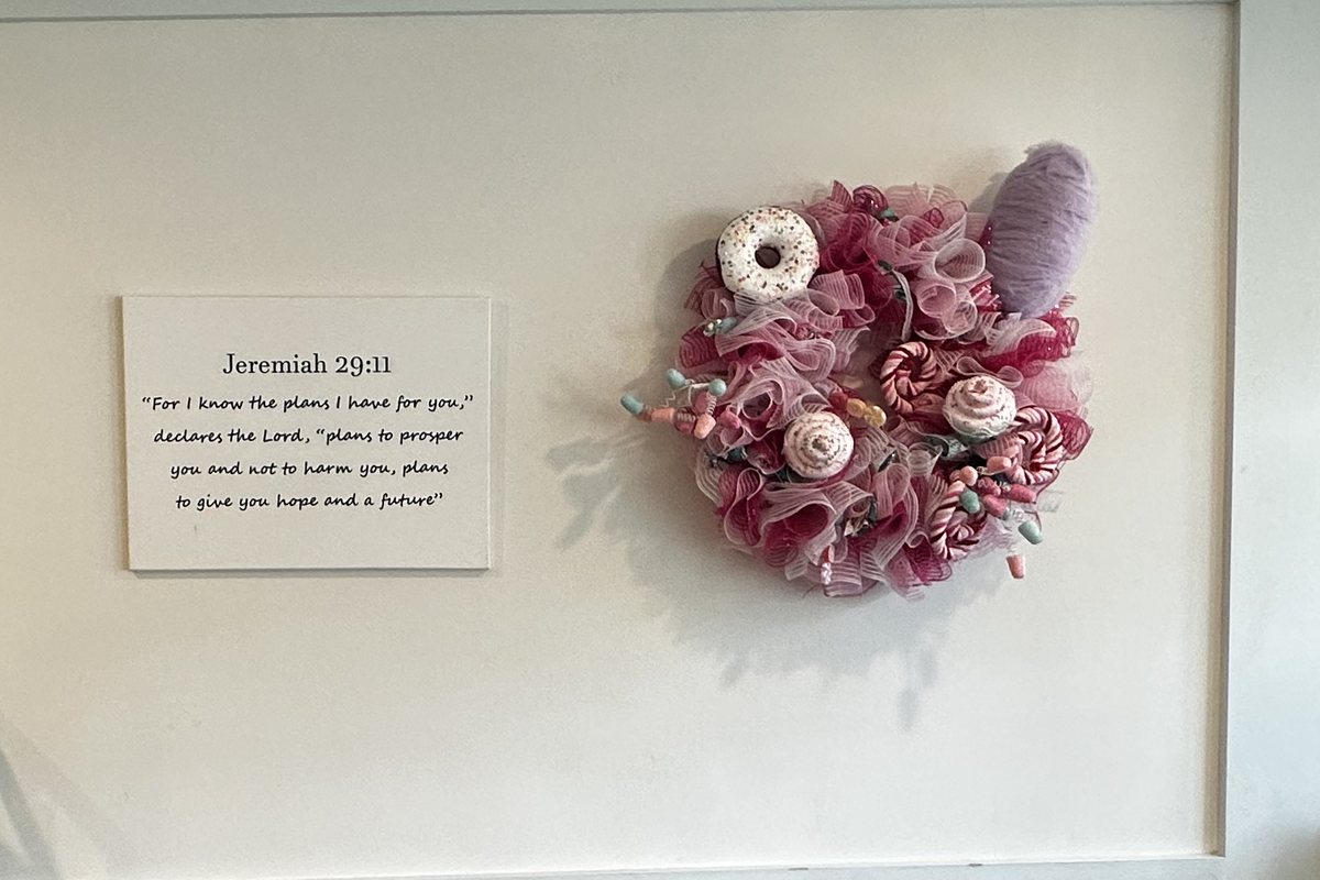 A framed Jeremiah 29:11 verse hanging on the wall inside Twisted Whisk